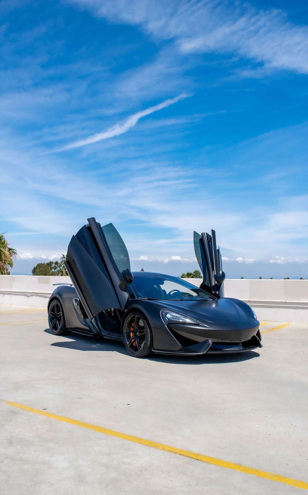 Black McLaren 570S for rent in Orange County (view 3)