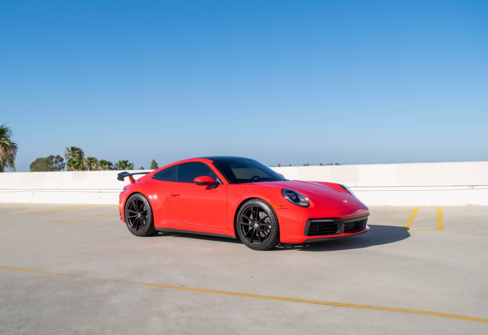 Red Porsche 911 Carrera for rent in Orange County