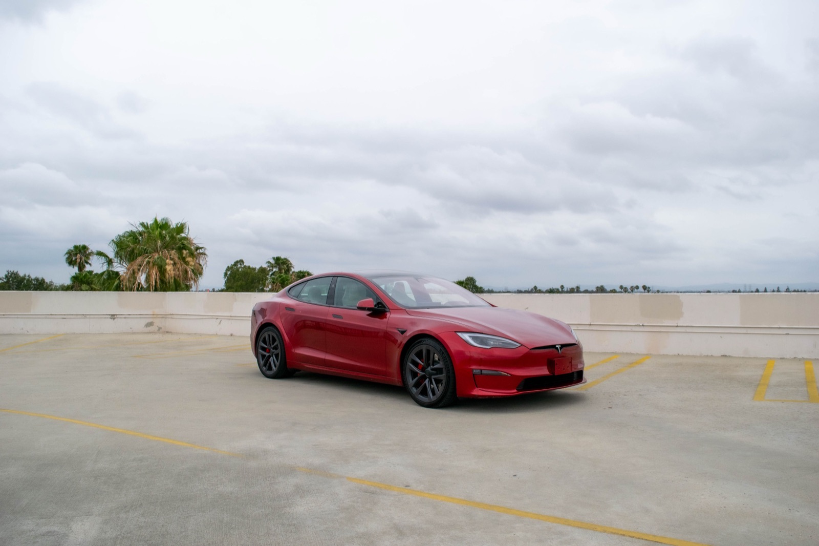 Red Tesla Model S for rent in Orange County